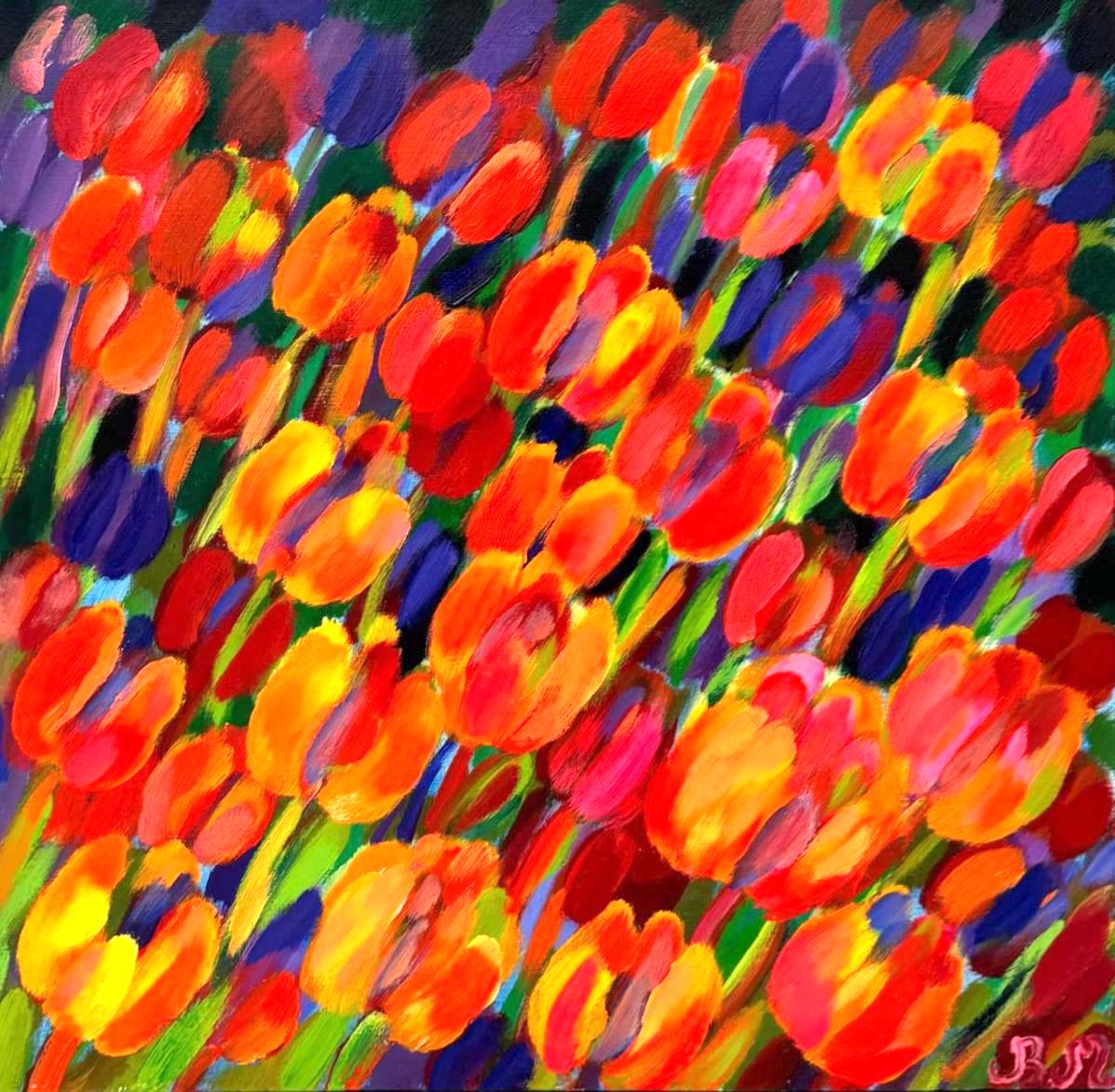 czerwone i żółte tulipany pochylone przez podmuch wiatru