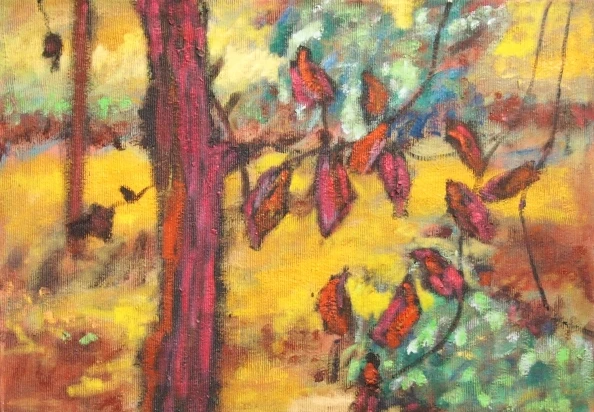 Jesienny krajobraz z dominującymi ciepłymi tonami żółci i czerwieni; na pierwszym planie czerwony pień drzewa i gałąź z intensywnie czerwonymi liśćmi, w tle rozmyte plamy światła i kolorów sugerujące leśne otoczenie